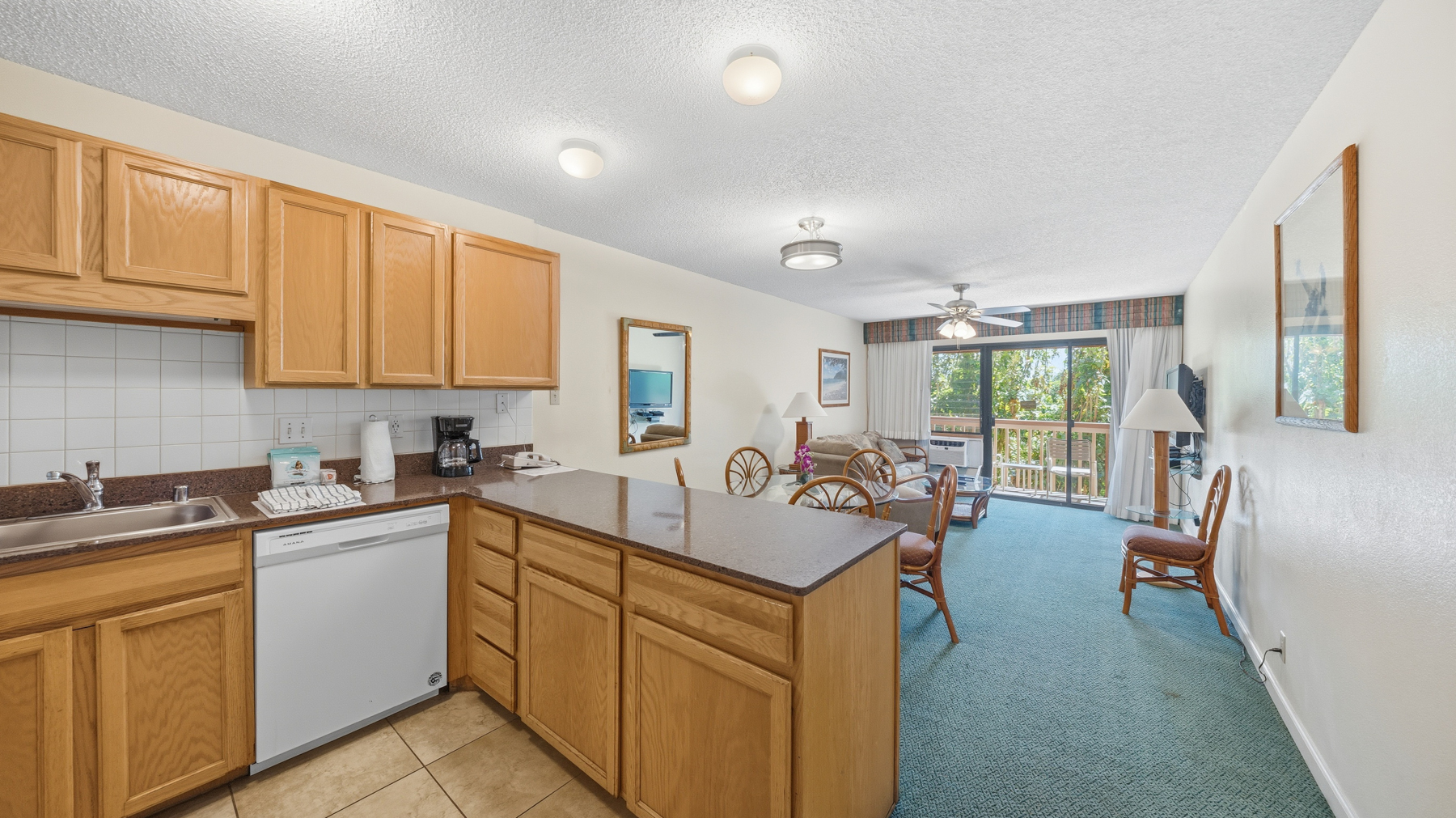 3411 Wilcox Road, Unit CV38 Lihue, HI 96766 - Photo 5 of 16 a kitchen with a sink stove and cabinets