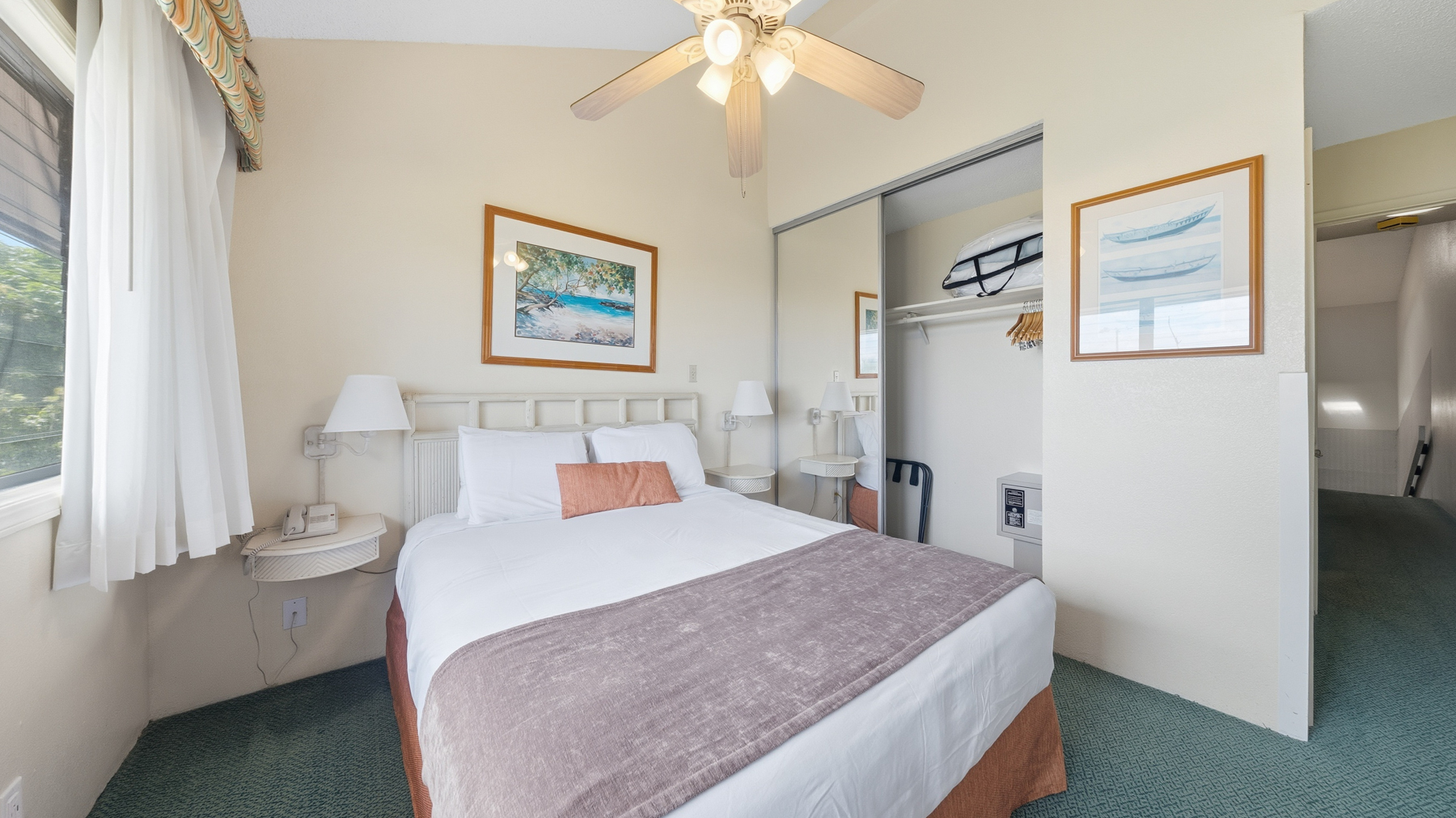 3411 Wilcox Road, Unit CV38 Lihue, HI 96766 - Photo 10 of 16 a bedroom with a bed and a chandelier