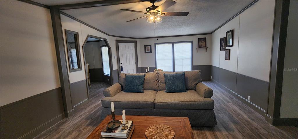 19865 Southwest 5th Place Dunnellon, FL 34431 - Photo 18 of 78 a living room with furniture and a rug