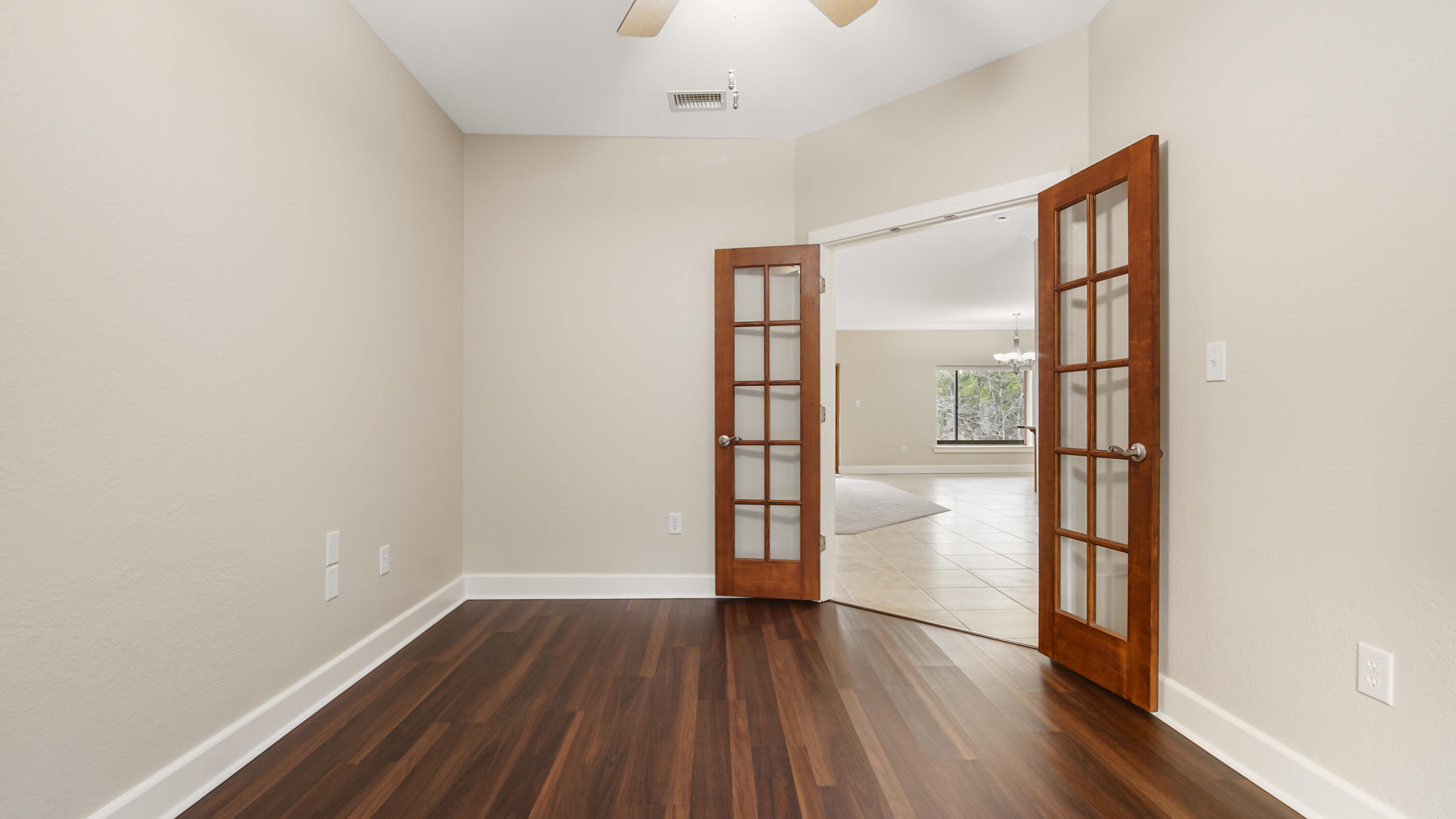 2060 Spring Lake Road DeFuniak Springs, FL 32433 - Photo 14 of 80 a view of empty room with wooden floor and fan