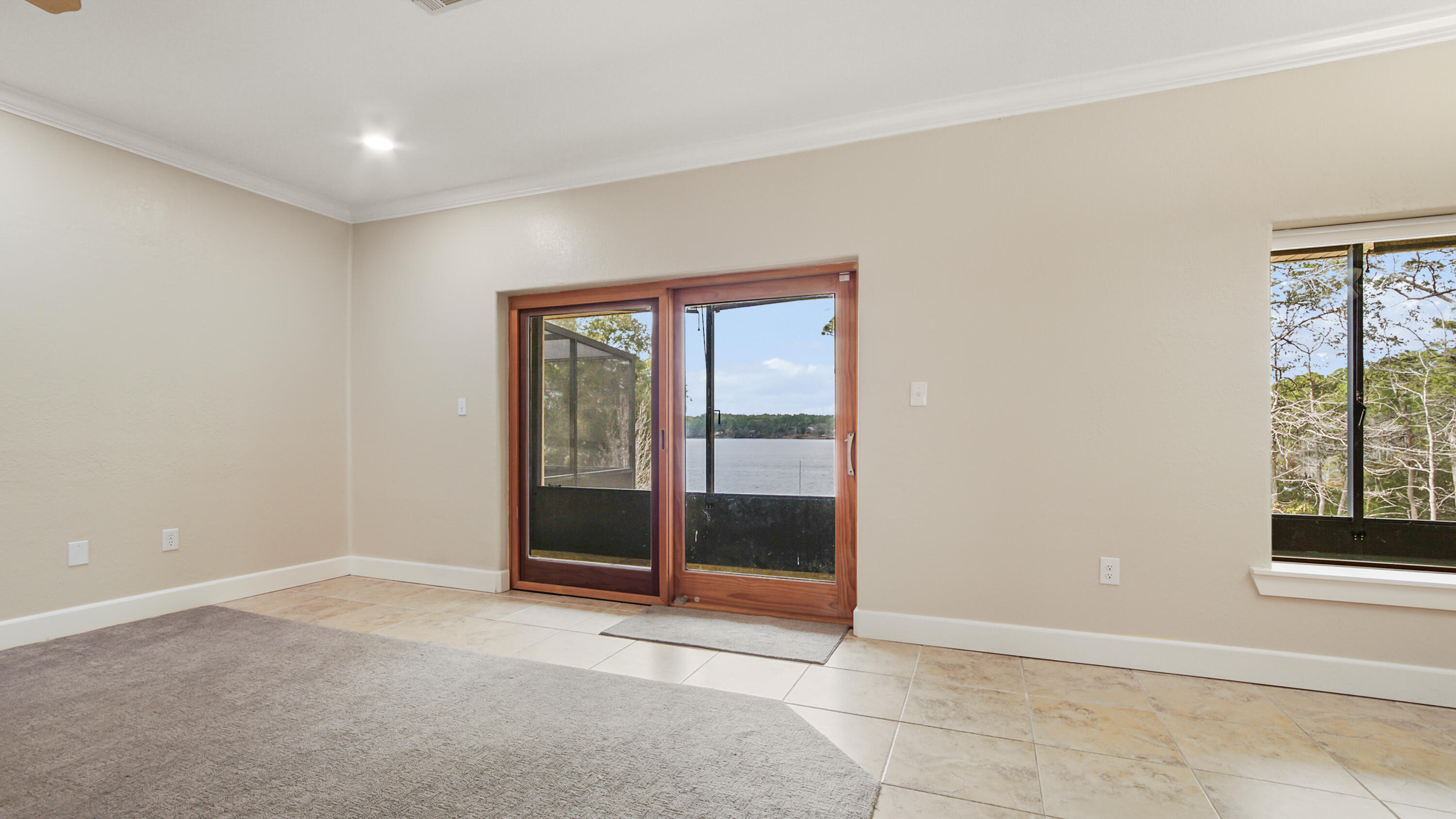 2060 Spring Lake Road DeFuniak Springs, FL 32433 - Photo 17 of 80 a view of an empty room with a window