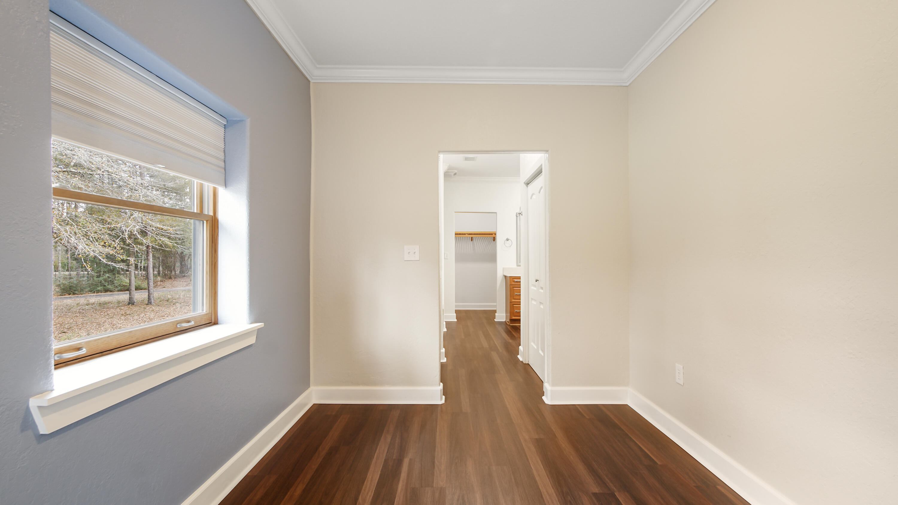2060 Spring Lake Road DeFuniak Springs, FL 32433 - Photo 30 of 80 a view of a room with wooden floor and a window