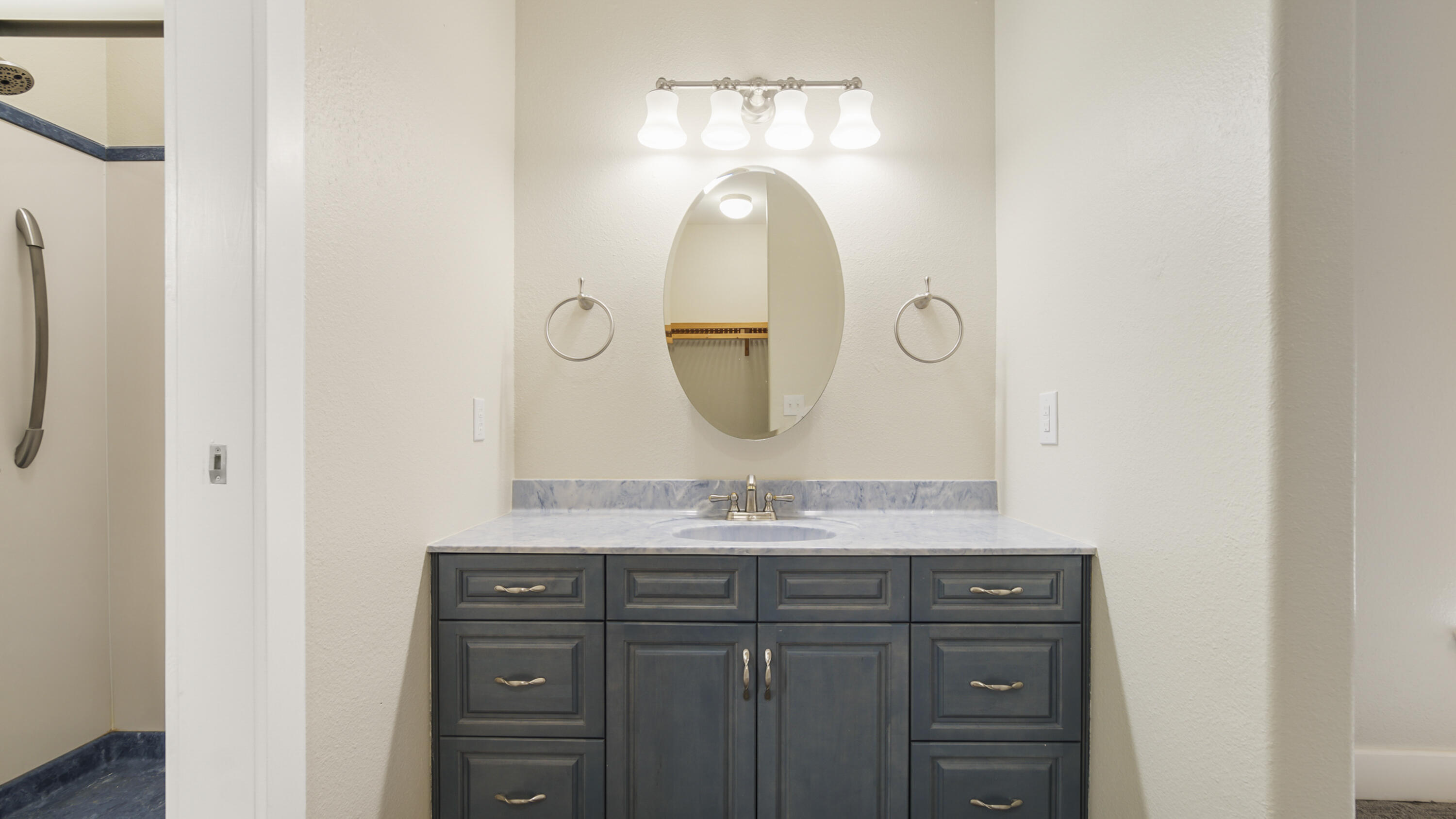 2060 Spring Lake Road DeFuniak Springs, FL 32433 - Photo 42 of 80 a bathroom with a sink and a mirror