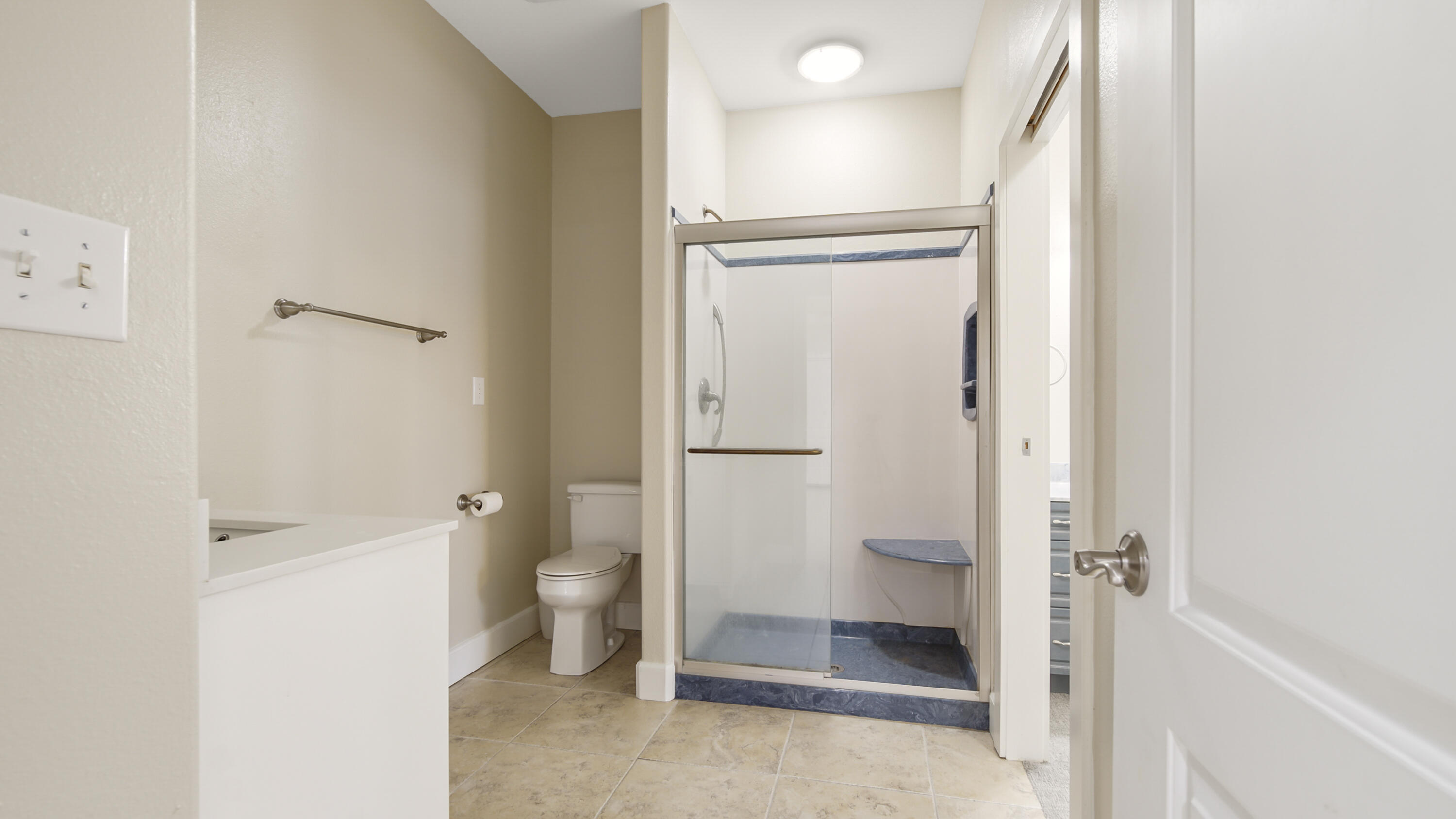 2060 Spring Lake Road DeFuniak Springs, FL 32433 - Photo 45 of 80 a bathroom with a granite countertop toilet and a shower