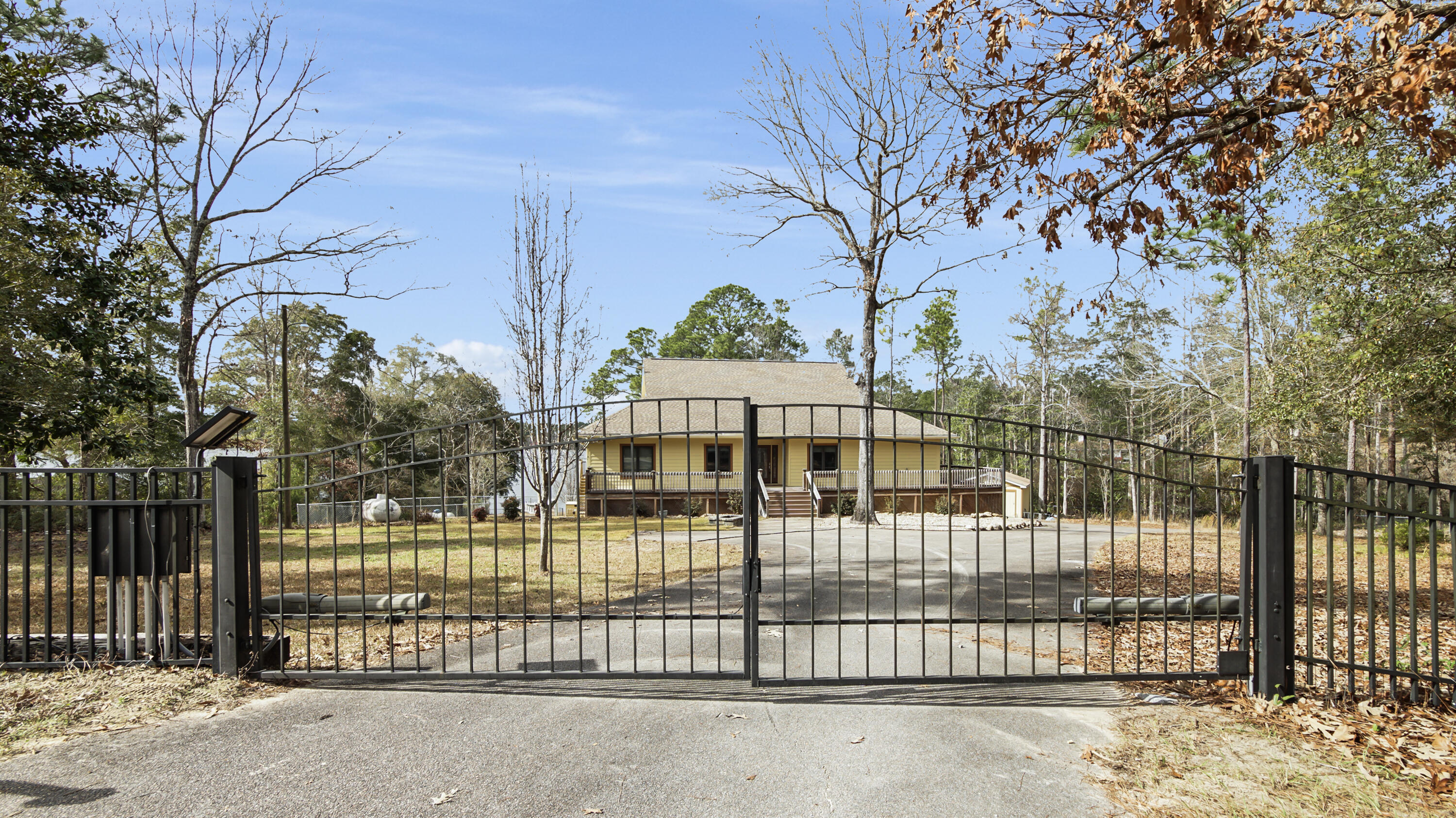 2060 Spring Lake Road DeFuniak Springs, FL 32433 - Photo 6 of 80 a view of a wrought iron fences in front of house