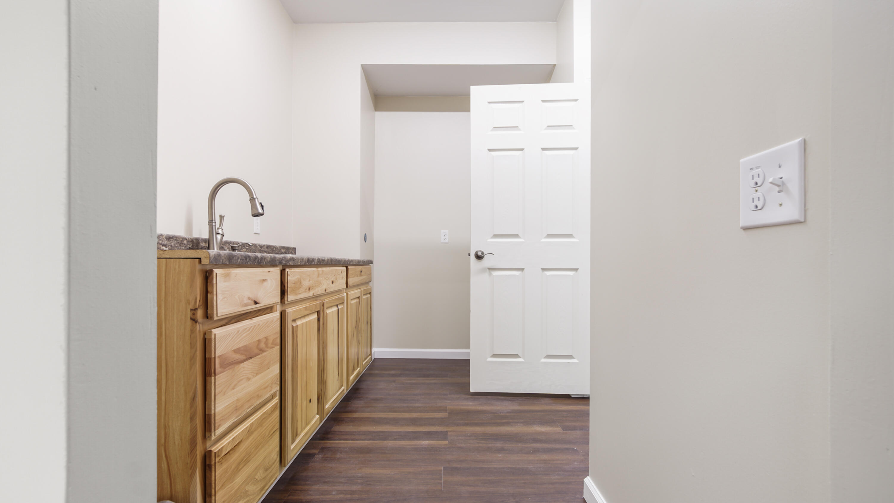 2060 Spring Lake Road DeFuniak Springs, FL 32433 - Photo 62 of 80 a view of a hallway with wooden floor