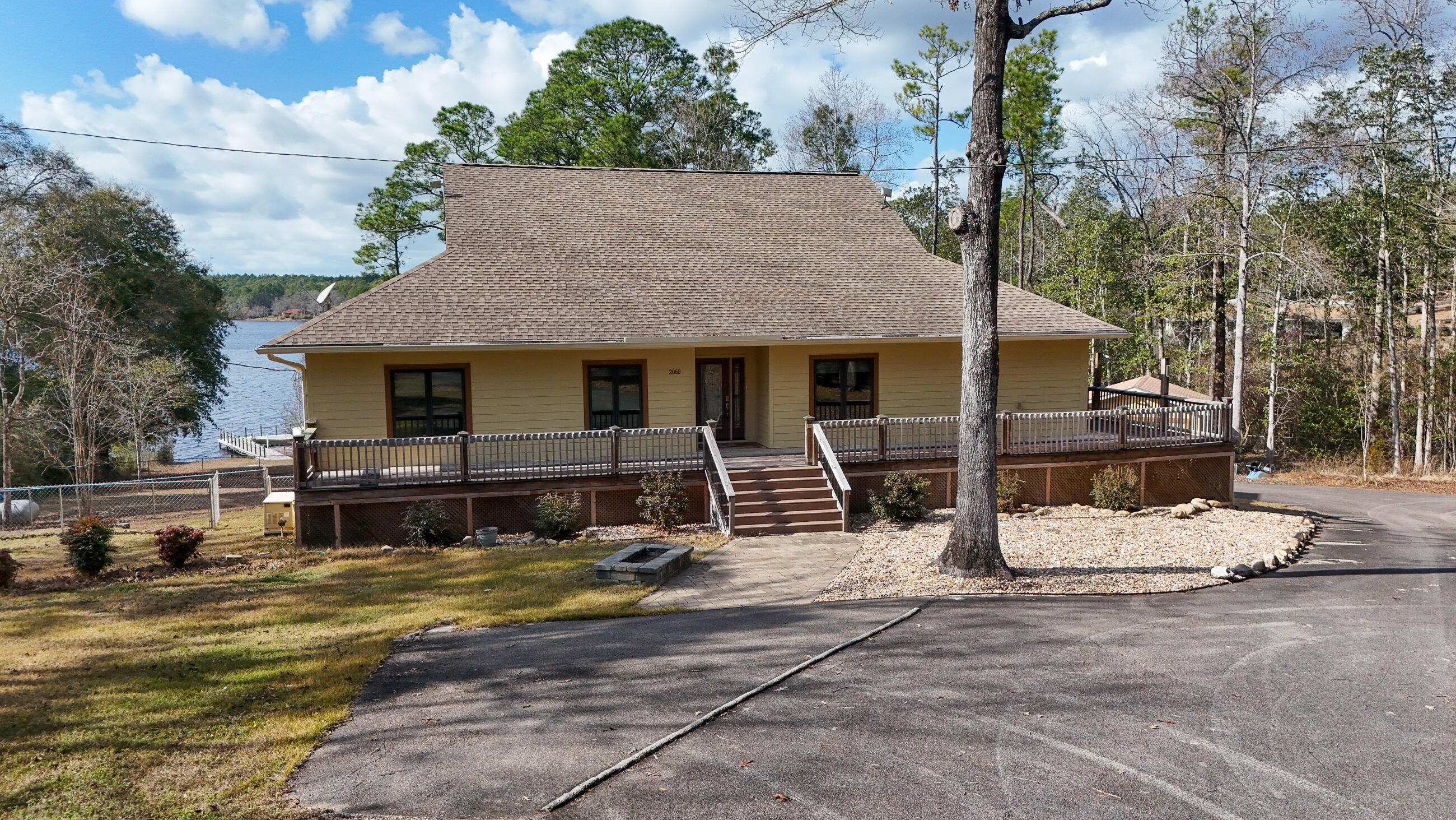 2060 Spring Lake Road DeFuniak Springs, FL 32433 - Photo 7 of 80 a view of a house with snow on the road