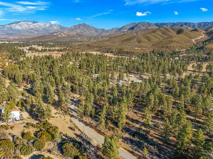 a view of a city with mountains in the background