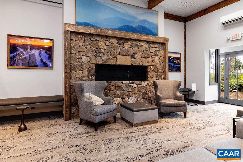 163 Mountain Inn Loop Roseland, VA 22967 - Photo 22 of 24 a living room with furniture and a fireplace