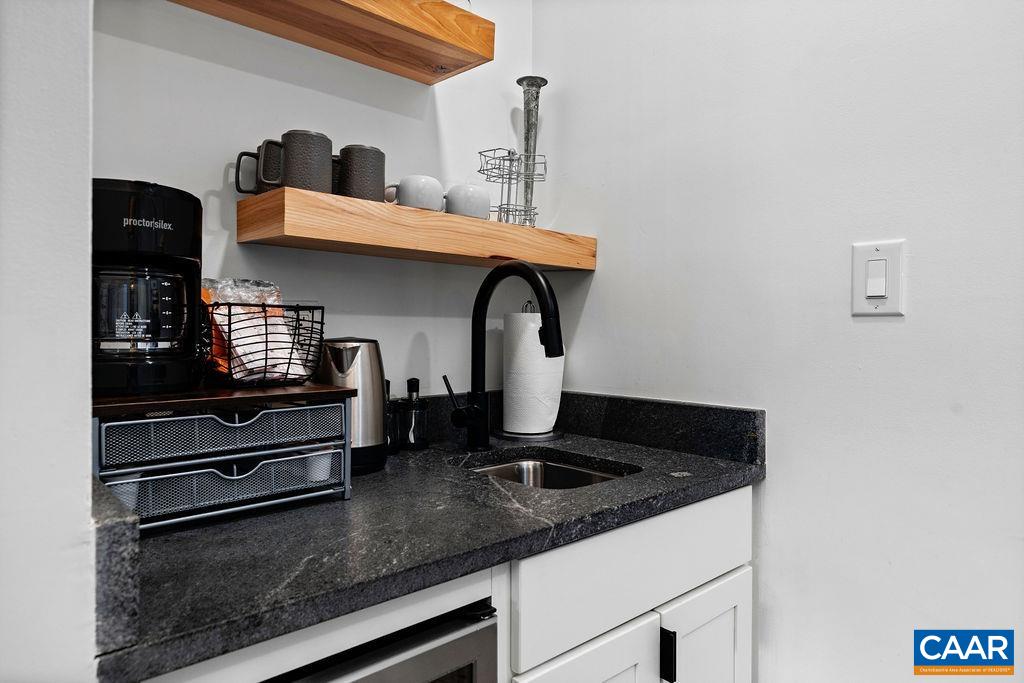 163 Mountain Inn Loop Roseland, VA 22967 - Photo 7 of 24 a kitchen with granite countertop stainless steel appliances and a sink