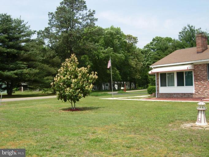 9789 Pearson Road Denton, MD 21629 - Photo 23 of 29 a view of a house with a backyard