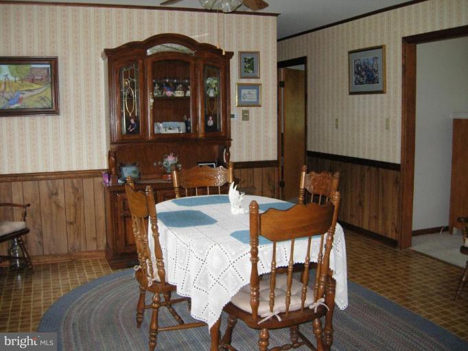 9789 Pearson Road Denton, MD 21629 - Photo 9 of 29 a view of a a dining room with furniture window and wooden floor