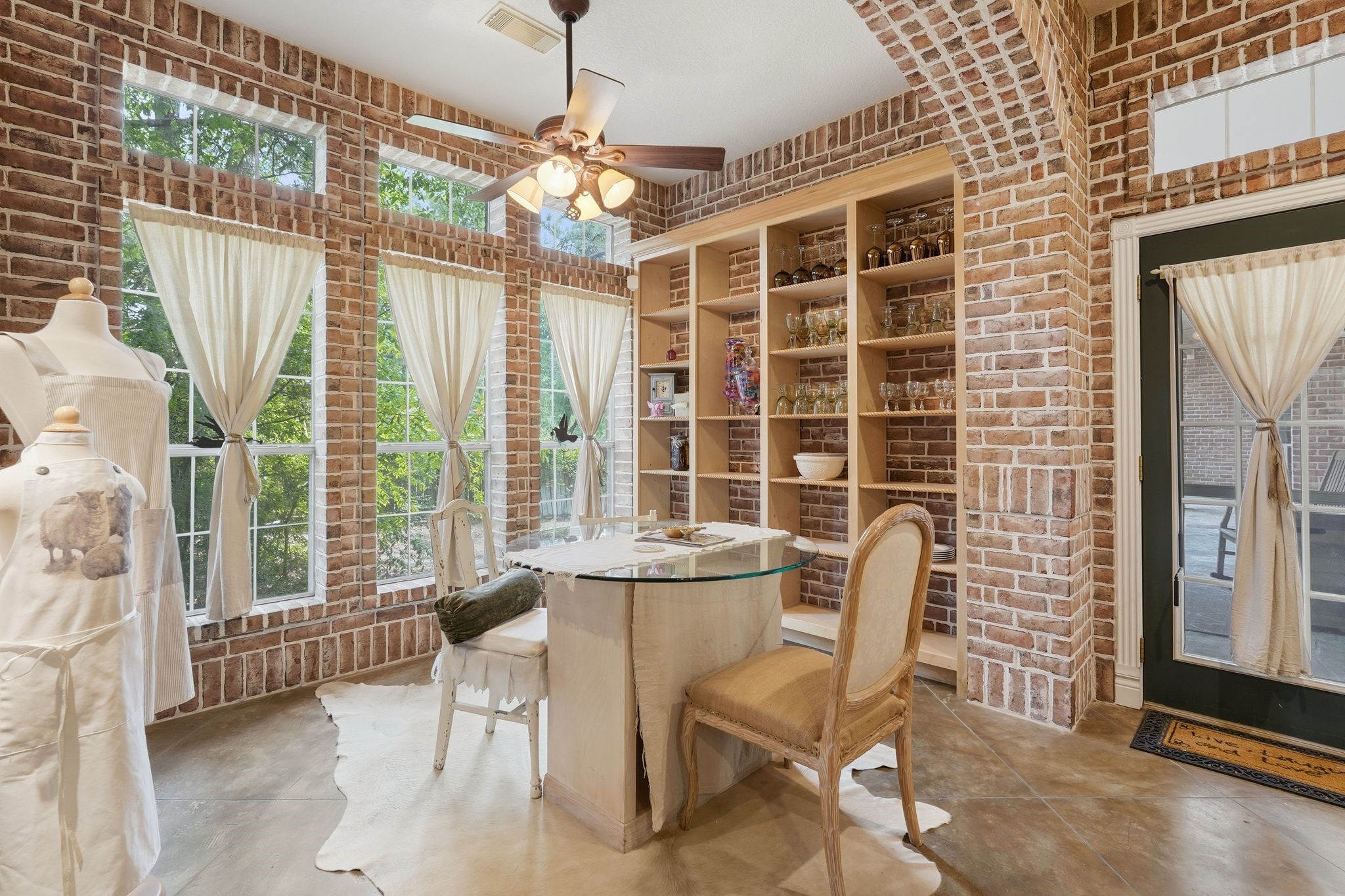 25014 Northampton Terrace Drive Spring, TX 77389 - Photo 13 of 50 Another look at the breakfast room complete with shelving for your favorite dinnerware,, glassware or knick-knacks. The side door opens to the covered back patio