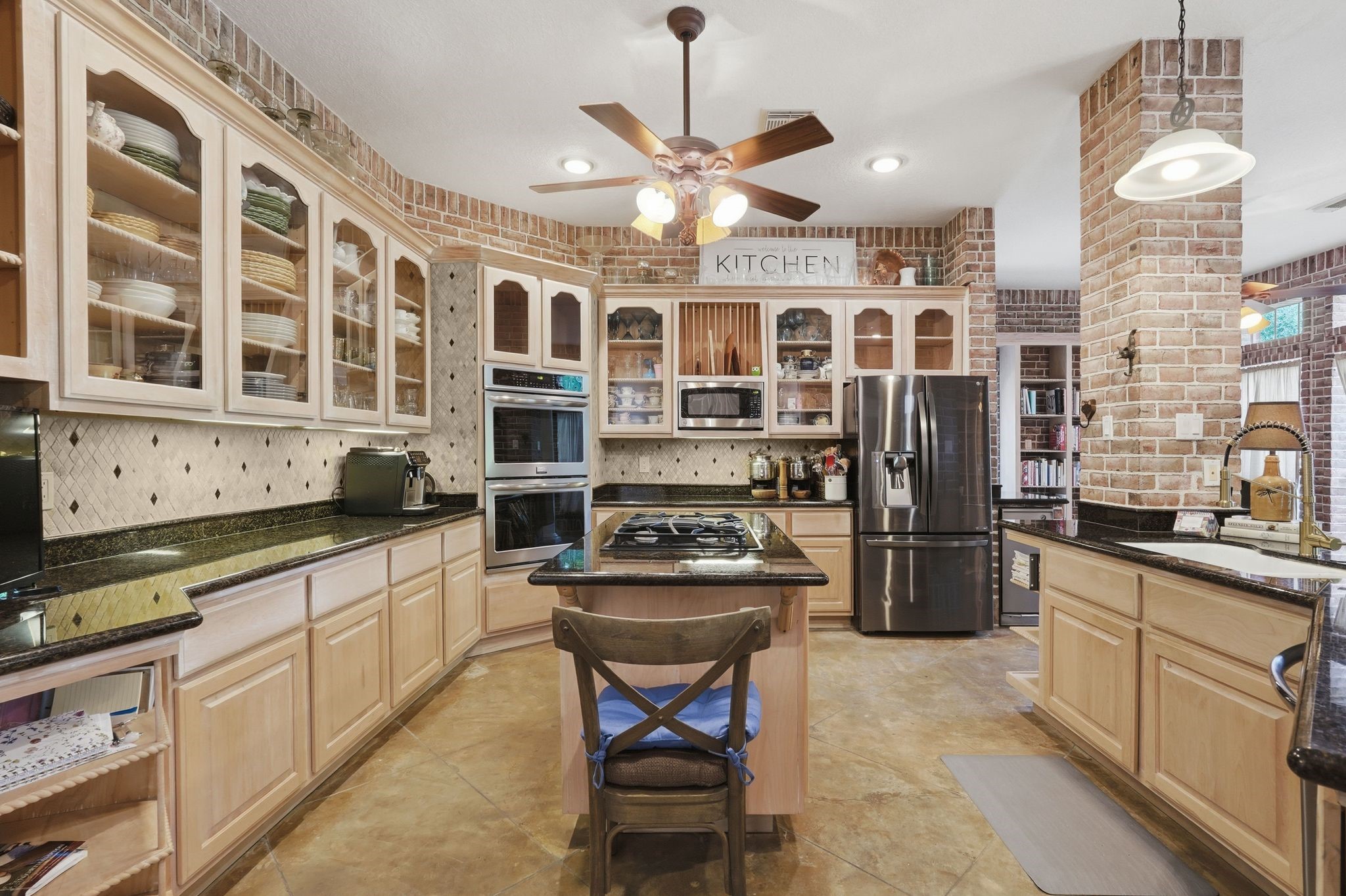 25014 Northampton Terrace Drive Spring, TX 77389 - Photo 17 of 50 The custom stained and etched concrete flooring is easy to care for and looks amazing!