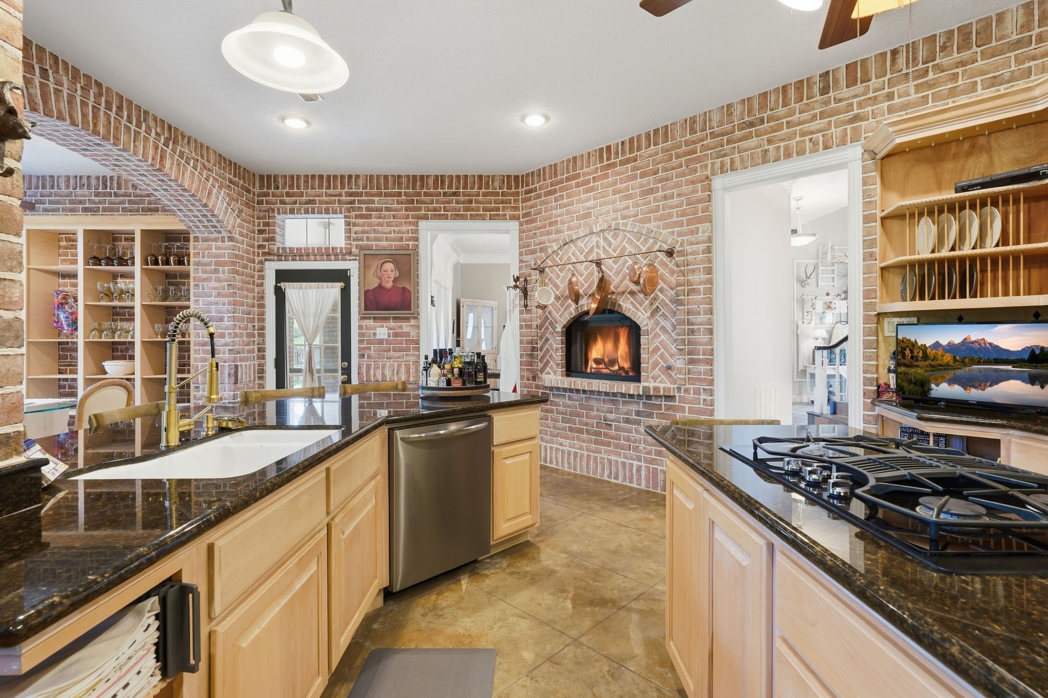 25014 Northampton Terrace Drive Spring, TX 77389 - Photo 19 of 50 Gaslog fireplace enhances the charm of the kitchen