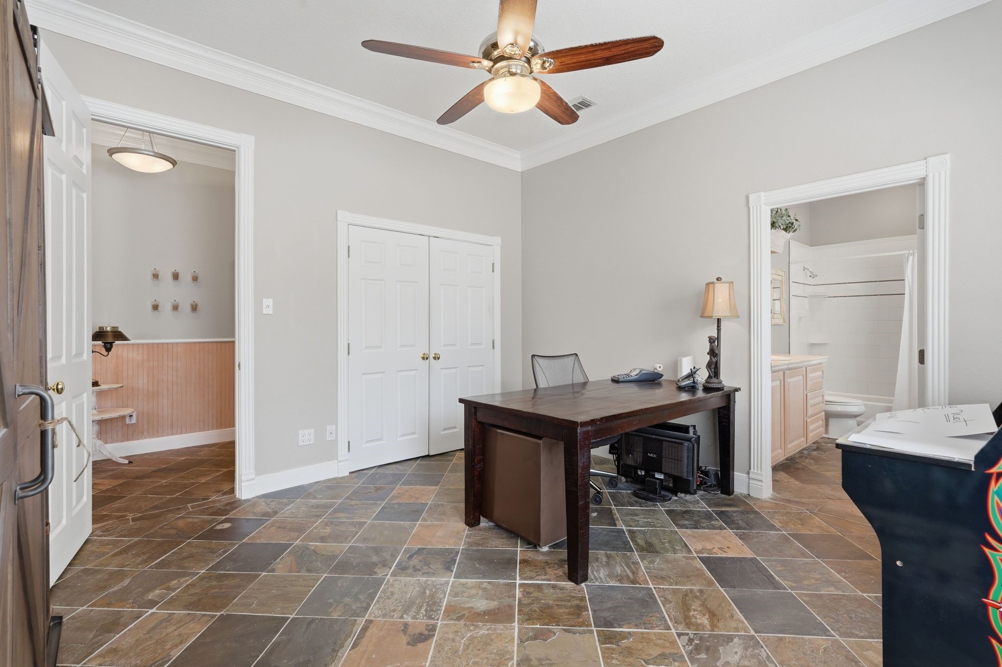 25014 Northampton Terrace Drive Spring, TX 77389 - Photo 30 of 50 Another view of the secondary first floor bedroom with large closet. And a peek into the ensuite bathroom.