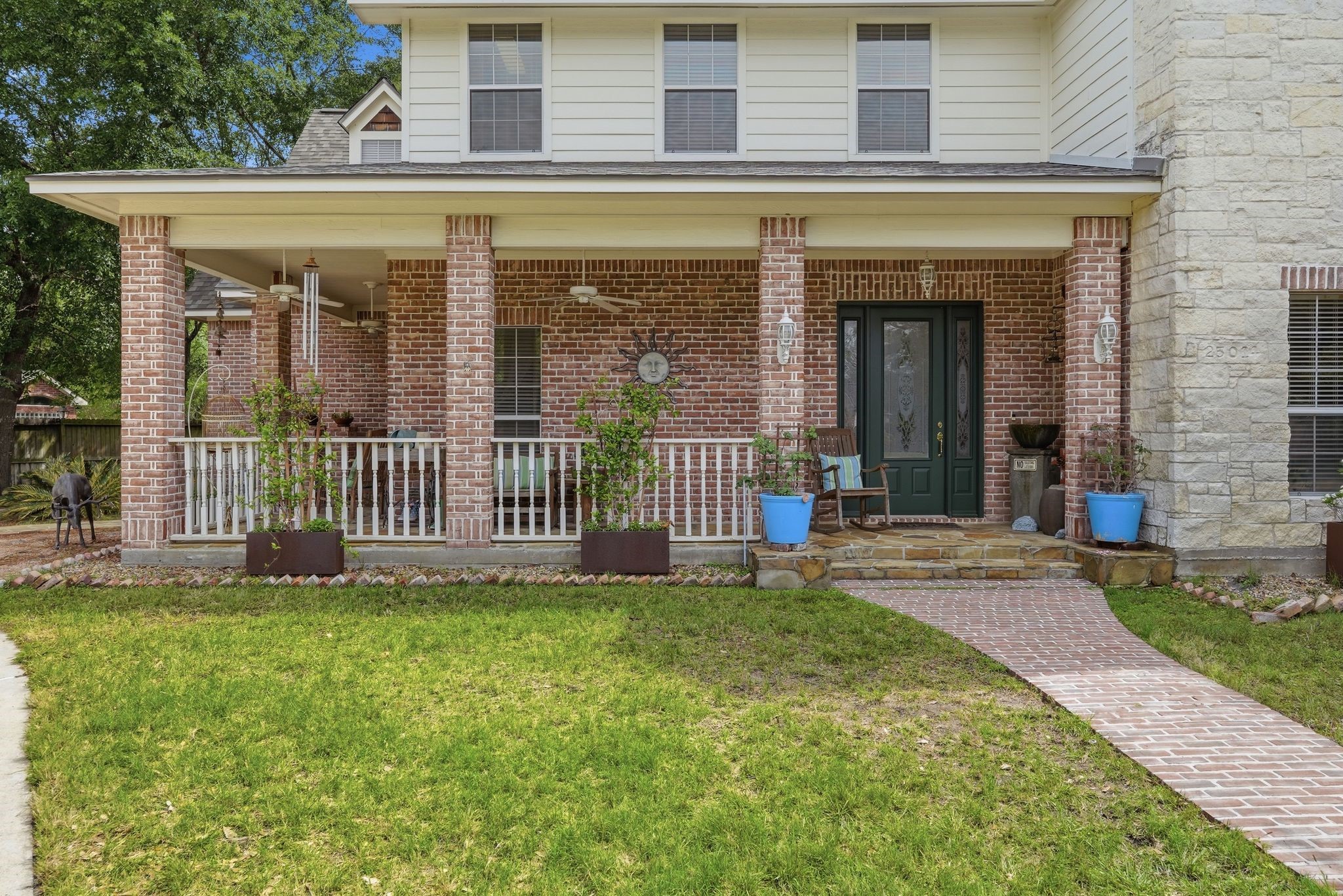 25014 Northampton Terrace Drive Spring, TX 77389 - Photo 5 of 50 The covered front porch offers a place to sit and enjoy the outdoors