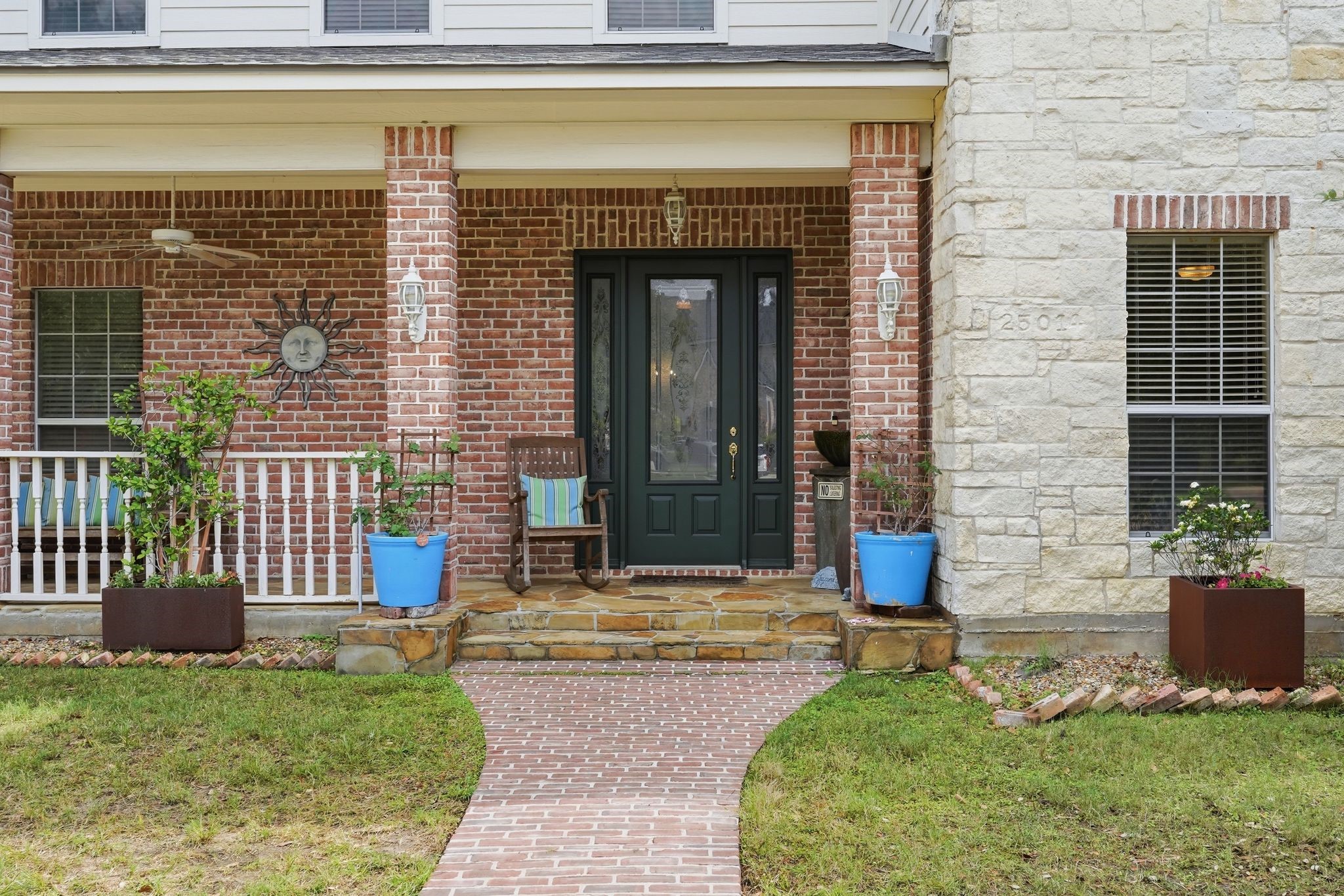 25014 Northampton Terrace Drive Spring, TX 77389 - Photo 6 of 50 The flagstone front porch and stone exterior warms this home