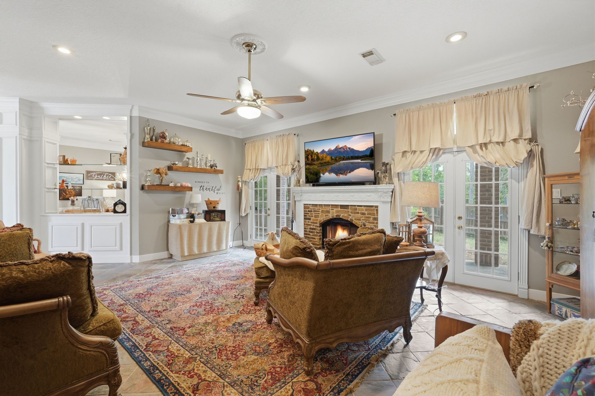 25014 Northampton Terrace Drive Spring, TX 77389 - Photo 10 of 50 Another view of the family room, with double french doors to the backyard