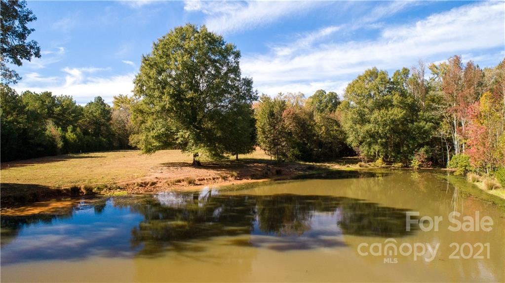 5967 Lockhart Road Sharon, SC 29742 - Photo 3 of 40 a view of a lake with trees
