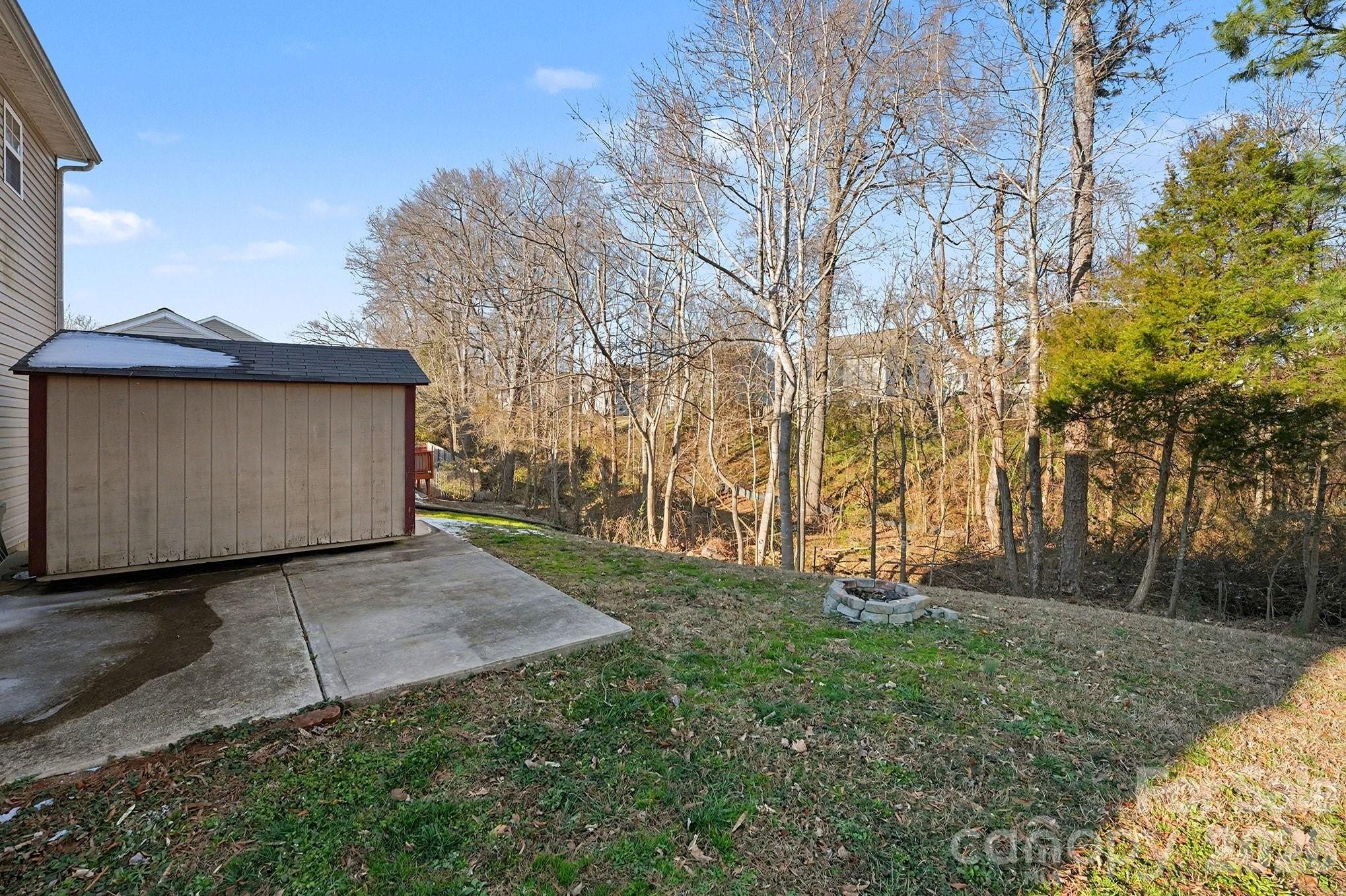 534 Canopy Court Clover, SC 29710 - Photo 16 of 16 a view of a backyard with large trees