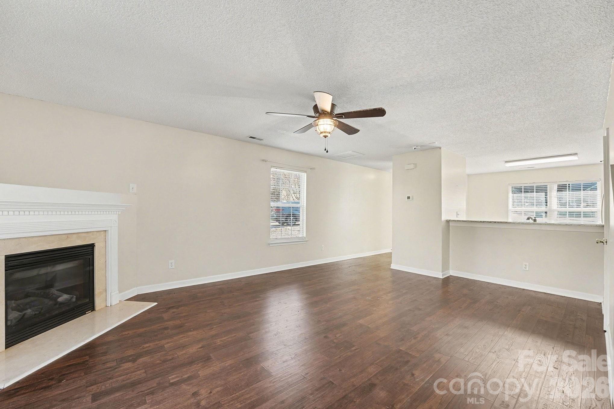 534 Canopy Court Clover, SC 29710 - Photo 4 of 16 a view of an empty room with a fireplace and a window