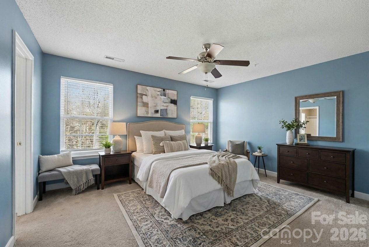 534 Canopy Court Clover, SC 29710 - Photo 8 of 19 a bedroom with a bed and a chandelier