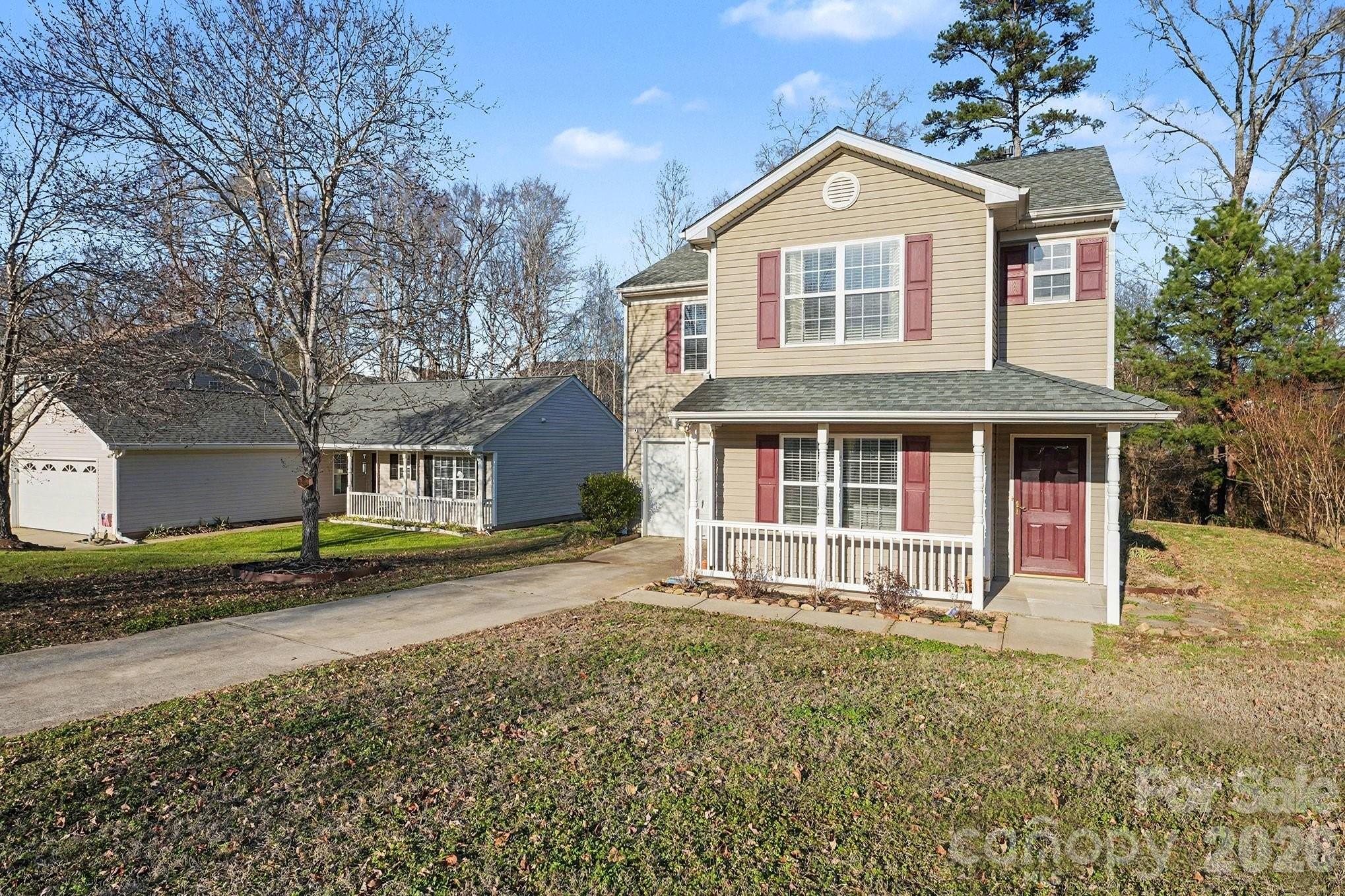534 Canopy Court Clover, SC 29710 - Photo 10 of 16 a front view of a house with a yard and garage
