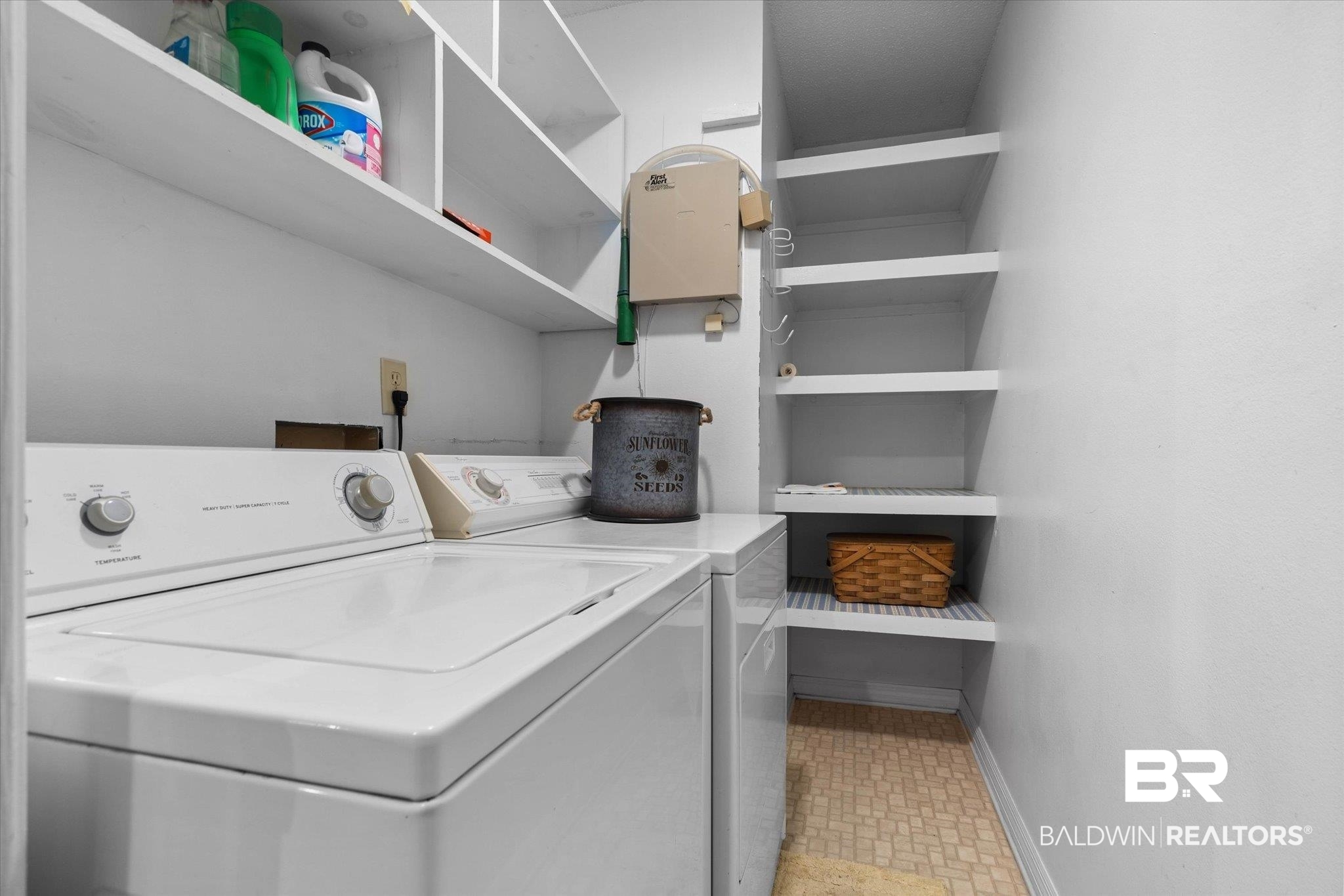 6632 Autumn Ridge Drive Mobile, AL 36695 - Photo 17 of 22 Laundry room with washing machine and clothes dryer and baseboards located upstairs.