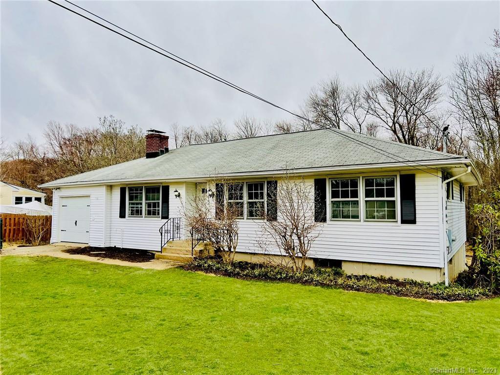20 Barnum Road Danbury, CT 06811 - Photo 1 of 1 a front view of house with yard and green space
