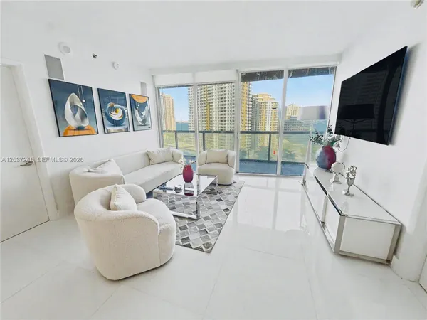 a living room with furniture and a flat screen tv
