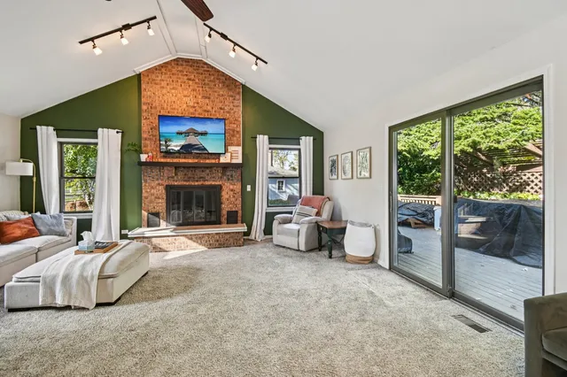 a bedroom with furniture and a fireplace