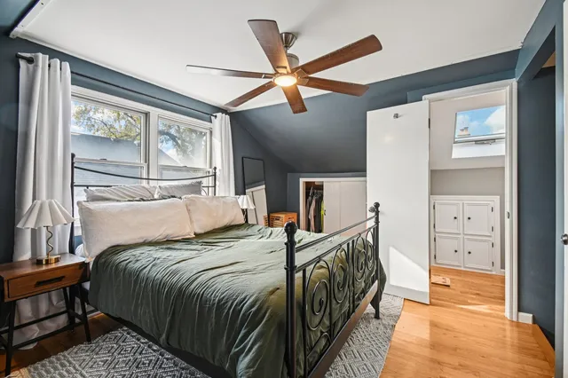 a bedroom with bed and balcony
