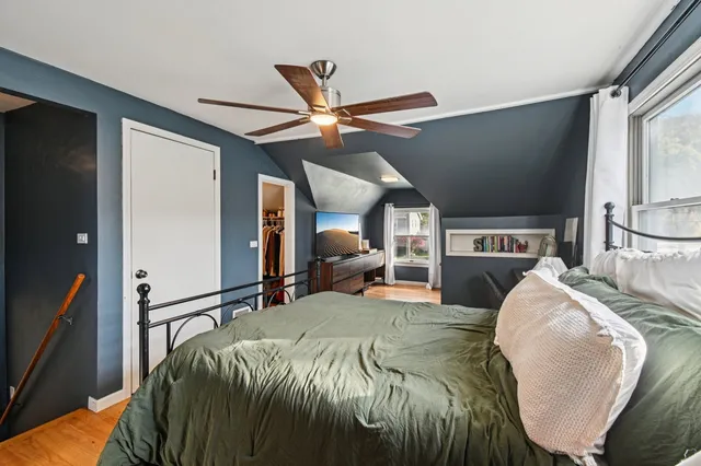 a bed room with a bed and a television