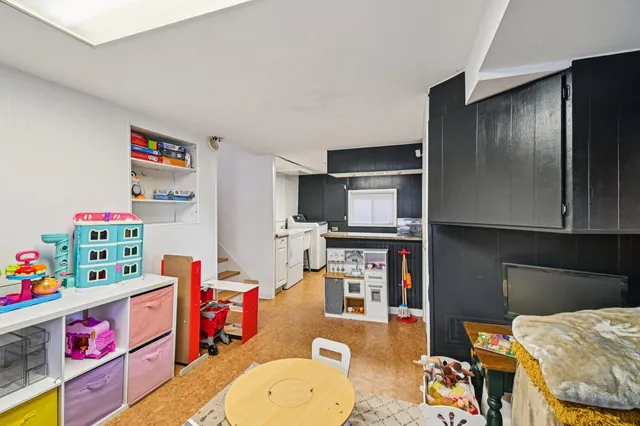 a children room with furniture and toys