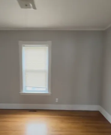 a view of an empty room and window