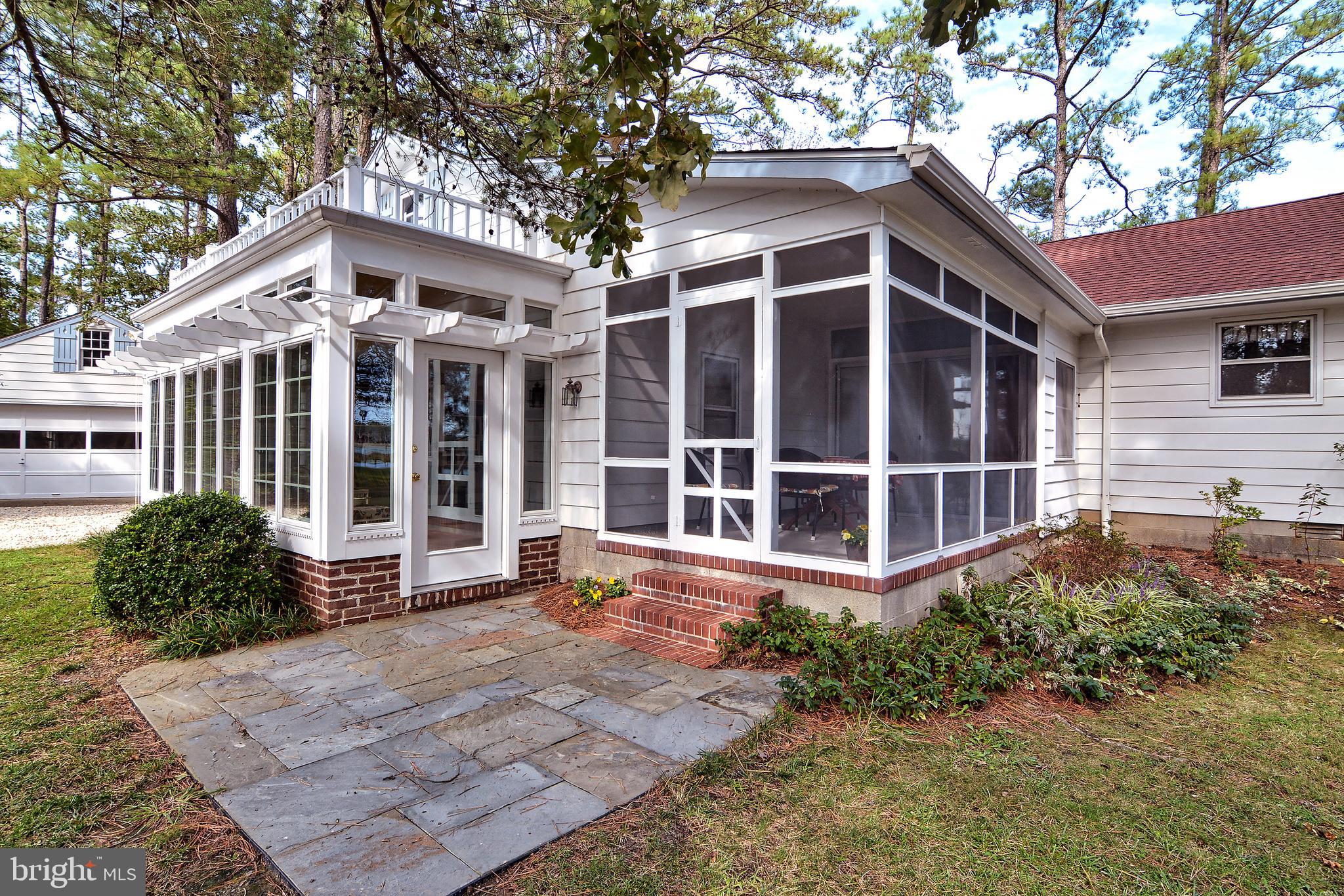 1015 Ross Thumb Road Cambridge, MD 21613 - Photo 6 of 64 Screened in Porch & Entrance to Sunny Game Room