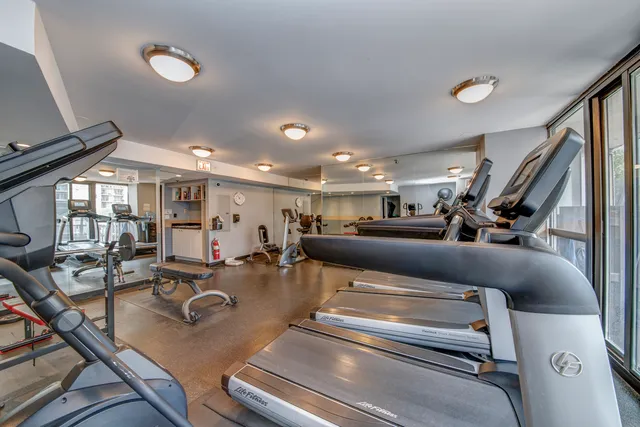 a view of a city with tall buildings and a big yard