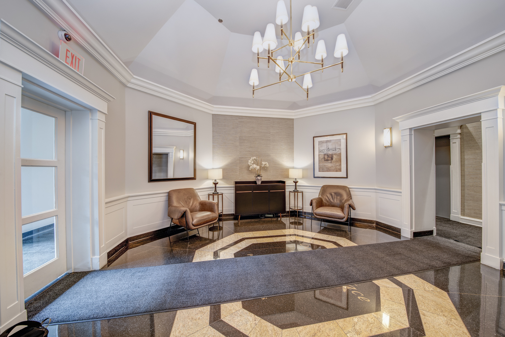 33 West Delaware Place, Unit 19H Chicago, IL 60610 - Photo 4 of 17 a living room with fireplace furniture and a chandelier