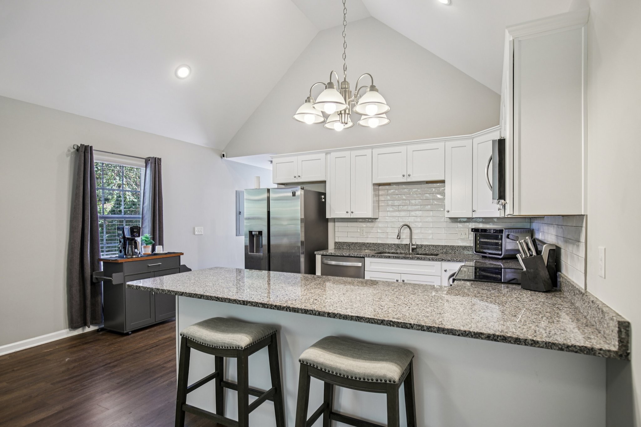 1122 Taylortown Road White Bluff, TN 37187 - Photo 18 of 56 a kitchen with stainless steel appliances granite countertop a sink refrigerator and cabinets