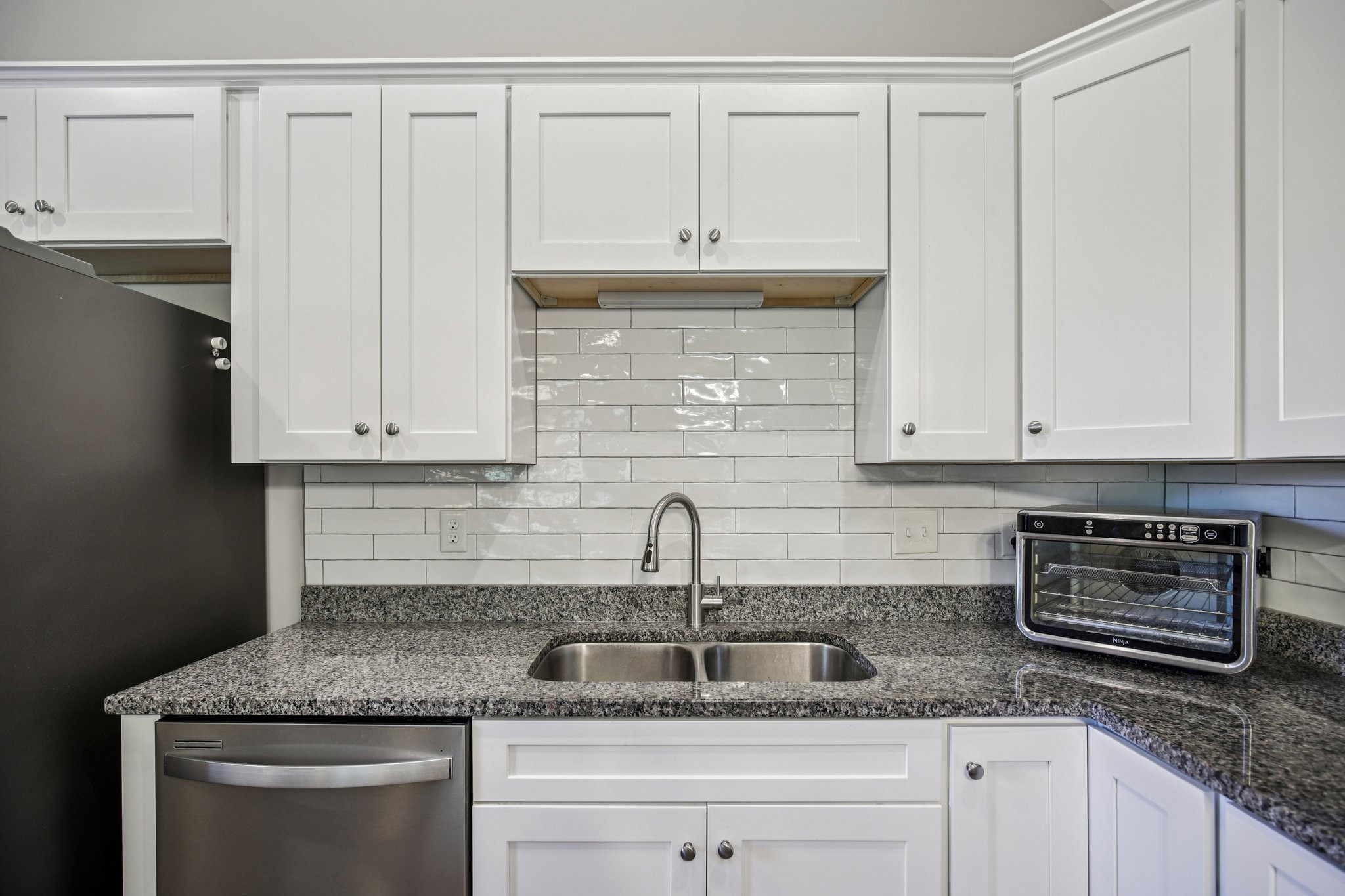 1122 Taylortown Road White Bluff, TN 37187 - Photo 26 of 56 a kitchen with granite countertop white cabinets and stainless steel appliances
