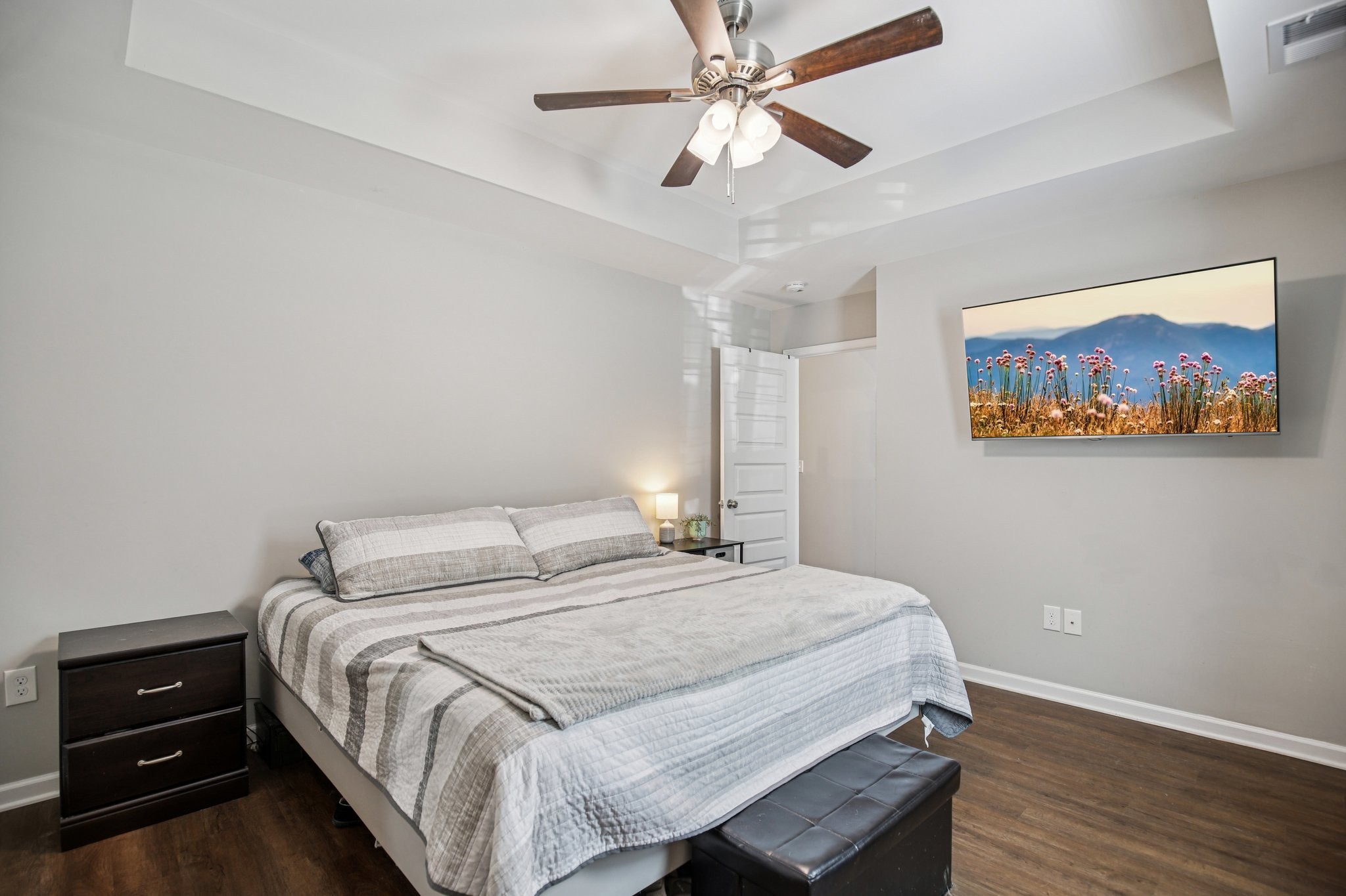 1122 Taylortown Road White Bluff, TN 37187 - Photo 38 of 56 a bedroom with a bed and a chandelier