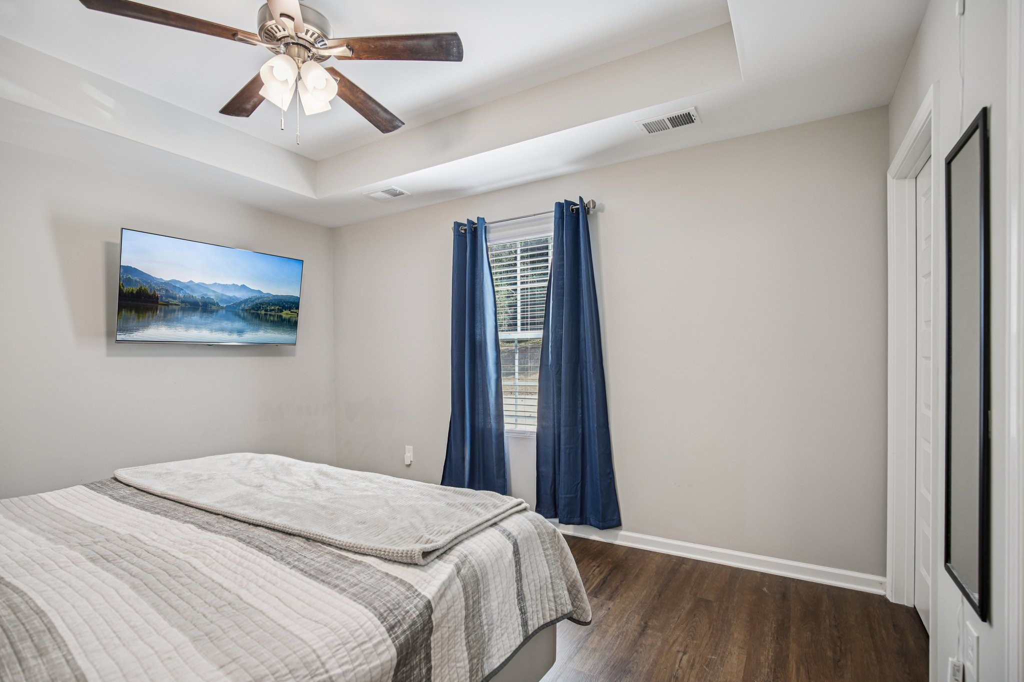 1122 Taylortown Road White Bluff, TN 37187 - Photo 39 of 56 a bedroom with a bed and a chandelier