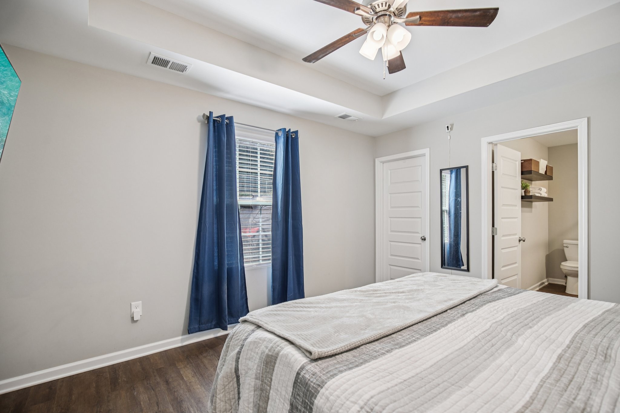 1122 Taylortown Road White Bluff, TN 37187 - Photo 40 of 56 a bedroom with a bed and a chandelier