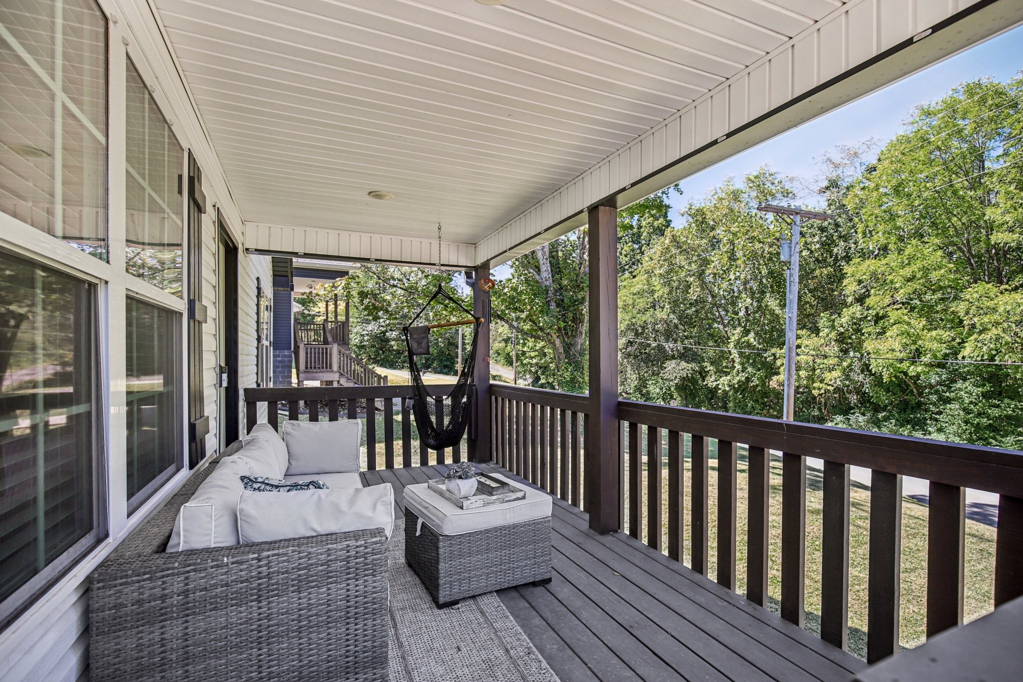 1122 Taylortown Road White Bluff, TN 37187 - Photo 6 of 56 a balcony with furniture and wooden floor