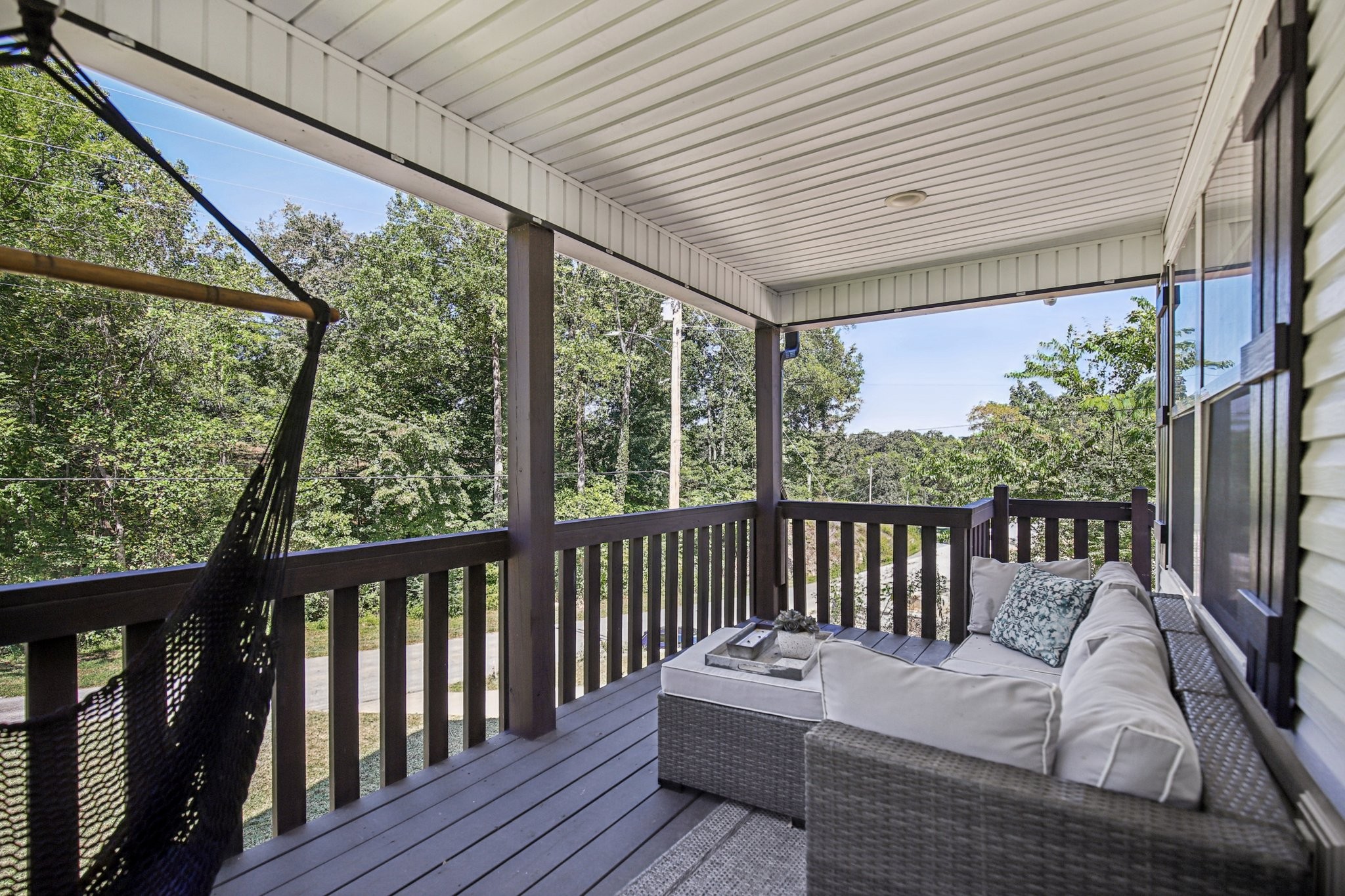 1122 Taylortown Road White Bluff, TN 37187 - Photo 8 of 56 a balcony with wooden floor and furniture