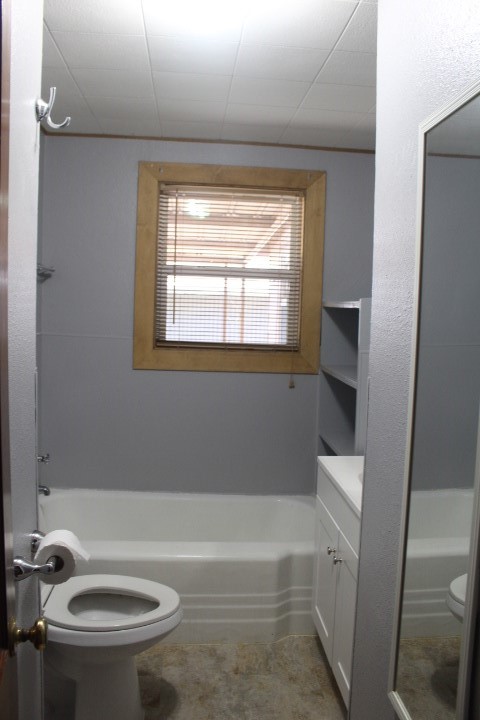 707 Alice Street Sweeny, TX 77480 - Photo 5 of 13 a bath room with a toilet and a bath tub