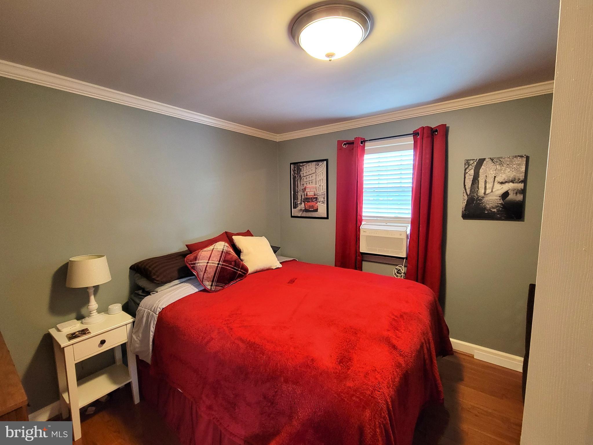 139 Mussetta Street Hanover, PA 17331 - Photo 16 of 58 a bedroom with a bed and wooden floor