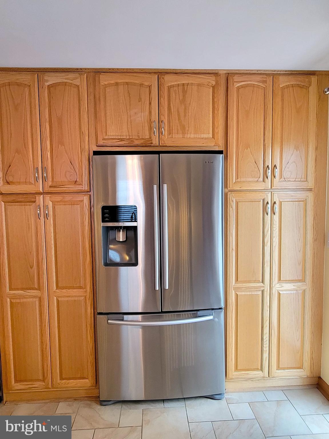 139 Mussetta Street Hanover, PA 17331 - Photo 18 of 63 a metallic refrigerator freezer sitting in a kitchen