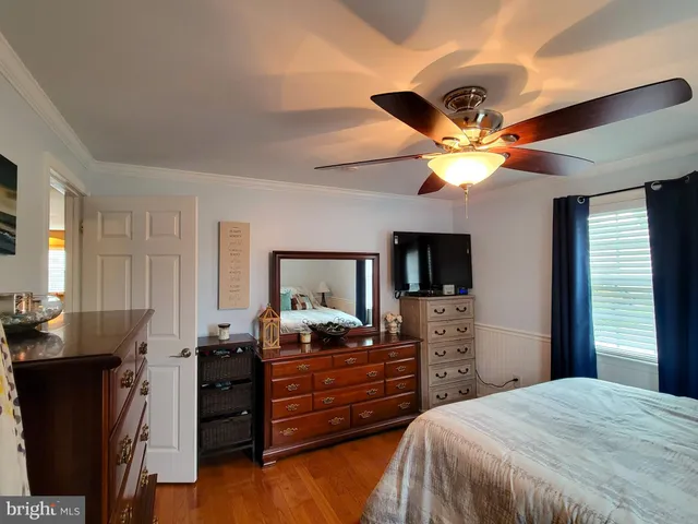 a bed room with a bed and a television